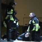 Военнослужащие штата Миннесота задерживают девушку, принимавшую участие в акции протеста