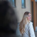 Worried young woman being followed